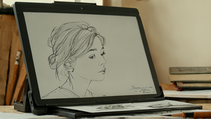 Animatrice travaillant sur une tablette graphique dans un studio d’animation.