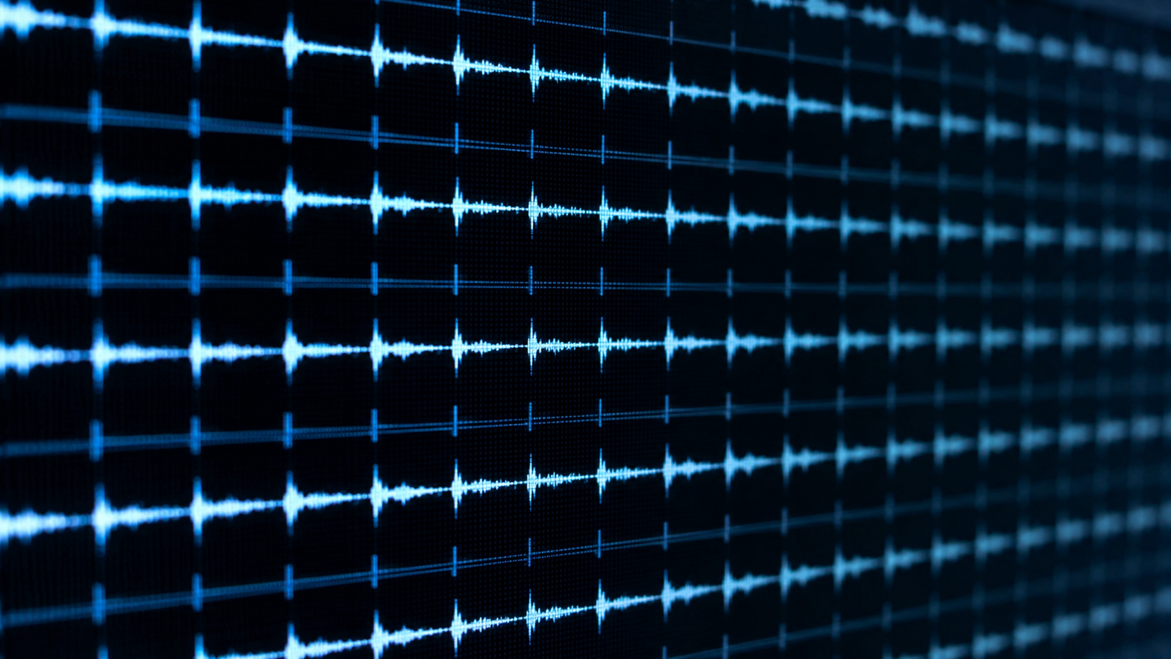 Des formes d'onde audio répétitives et uniformes sur un écran sombre